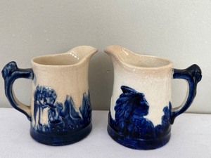 lot 102 image: Pair of Vintage Sleepy Eye Pitchers