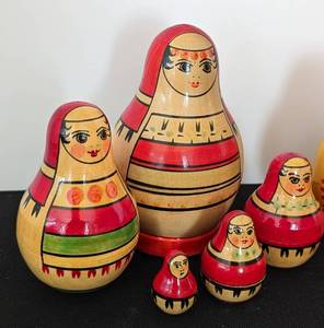 lot 65 image: Three Vintage Russian Nesting Doll Sets