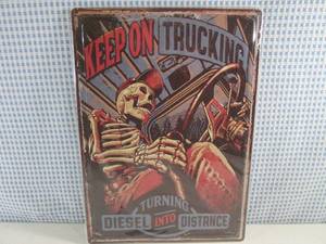 lot 123 image: (C-3) Keep On Trucking Tin Sign Emb...