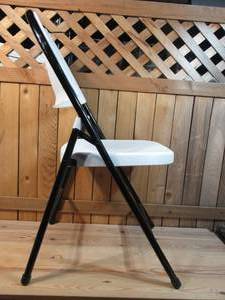 lot 90 image: White Folding Chair w Black Frame