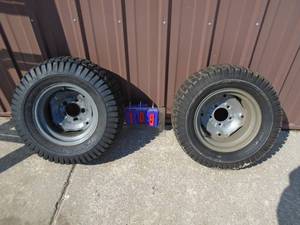 1 pair Craftsman GT6000 rear wheels & tires. 23 x 10.50 x 12. One rim has elongated holes. As shown.
