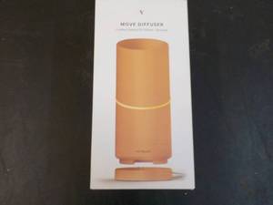 lot 65 image: Vitruvi Move Diffuser Cordless Esse...