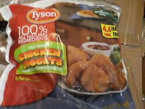 lot 220 image: 4.4 lb. bag Frozen Tyson Chicken Nu...
