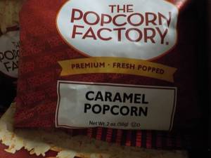lot 296 image: Case of 2 oz Bags The Popcorn Facto...