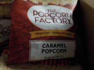 lot 298 image: Case of 2 oz Bags The Popcorn Facto...