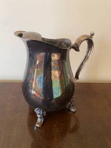 lot 39 image: Silver-Toned Pitcher with Unique Feet