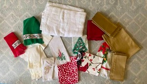 lot 98 image: Christmas Towels, Gold-Toned Napkins & Runner, and More