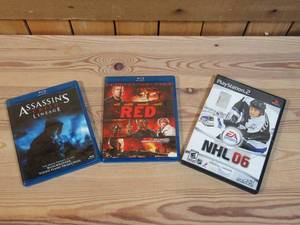 lot 31 image: Lot of THREE ITEMS TWO BluRay DVDs Assassins Creed Lineage & RED, ONE Playstation 2 game NHL 06