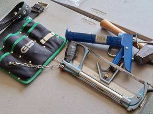 lot 573 image: Lot of (5) Hand Tools - Commercial Electric Soft-Side Tool Belt, Hacksaw, Sledgehammer, Contractor Square, Caulk Gun