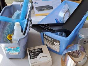 lot 607 image: Lot of (2) Totes with Window Washing BrushSqueegeeBottle, Everbilt Air Diffuser, Nashua Insulated Tape, Metal Shelf Brackets