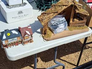 lot 645 image: Lot of (2) Christmas Dcor - The Old Curiosity Shop Ceramic House, Manger Scene in Wood and Natural Materials