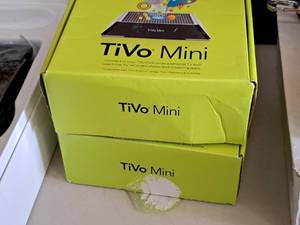 lot 706 image: Lot of (2) TiVo Mini (in original packaging)