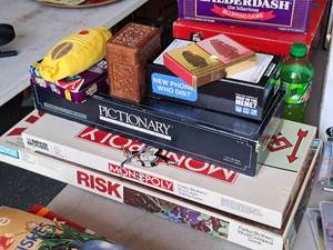 lot 719 image: Lot of (8) Board Games - Monopoly, Risk, Pictionary, What Do You Meme, Congress Playing Cards, Two Decks Playing Cards, Bananagrams, UNO