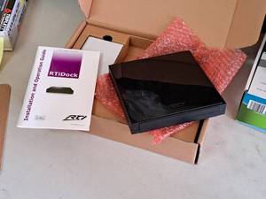 lot 750 image: RTi RTiDock iPod Docking Station (New in Box)