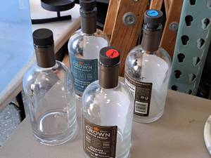 lot 735 image: Lot of (4) 25-fl.oz Maple Syrup Bottles