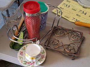lot 736 image: Lot of  Misc. Kitchenware - Cup and Saucer, Trivets, Thermos Mugs, Flatware, Ladle, and more
