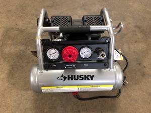 lot 18 image: 1 Gal. Portable Electric-Powered Silent Air Compressor by Husky   Customer Returns See Pictures