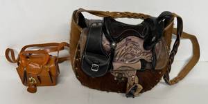 lot 42 image: Two Ornate Leather Saddle Shaped Handbags