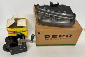lot 60 image: Silverado -03-07 Pickup Passenger Side Headlamp Replacement In Original Box And Central Force 2,000 Lb Geared Winch