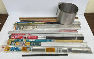 lot 138 image: Bucket Of Thresholds, Roll Of Aluminum And More