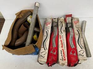 lot 185 image: Large Group Of Misc. Exhaust Pipe Pieces And Repair Kits