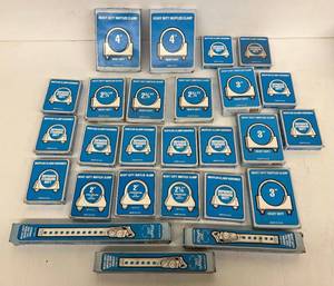 lot 206 image: Group Of Misc. Sizes Of MI Heavy Duty Muffler Clamps And Tail Pipe Hangers