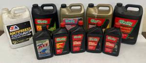 lot 230 image: Group Of Misc. Name Brand Antifreeze And Oreilly Brand Transmission Fluid (4 Antifreeze Bottles Half Full)