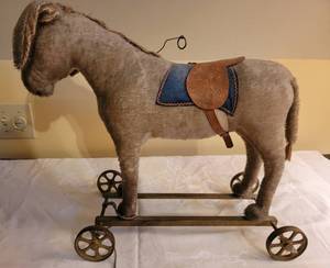 lot 1 image: Antique German Bing Donkey Riding Pull Toy with Tag