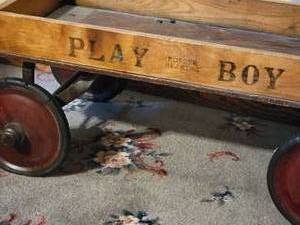 lot 97 image: Antique Play Boy Wooden Coaster Wagon Toy