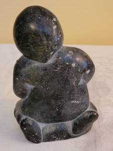 lot 179 image: Canada Eskimo Art Carved Stone Kneeling Man with Fish, signed and dated