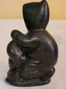 lot 180 image: Canada Carved Stone Seated Man with Seal