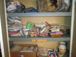 lot 235 image: Cupboard full of assorted paper pla...
