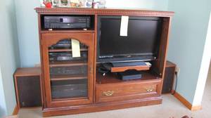 lot 32 image: Medium toned wood entertainment and multimedia cabinet
