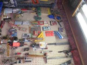 lot 217 image: Pegboard collection of tools and ha...