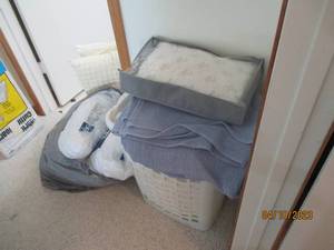 lot 255 image: Overflowing laundry hamper style ba...