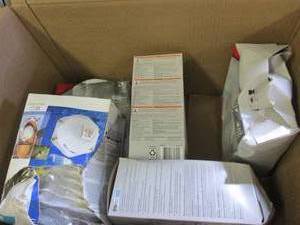 lot of masks , paper plates and mor...