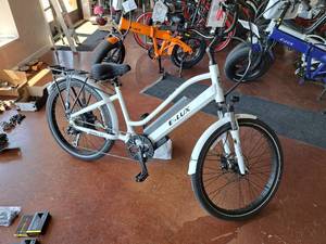 lot 91 image: E-Lux Malibu Stepthru GT 48V 9-speed 26 Electric Bike Gloss White Frame (New in Box)