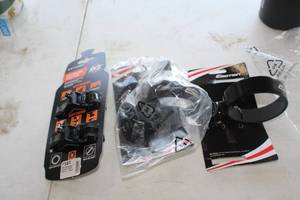 lot 488 image: Lot of (3) Bike Accessories - Anywhere Adapter, Emotion Bottle Holders (x2)