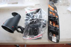 lot 485 image: Lot of (3) Bike Accessories - Anywhere Adapter, Emotion Bottle Holder, Bottle Holder