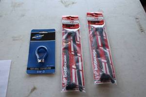 lot 514 image: Lot of (3) Bike Accessories (in original packaging) - Elite VIP Bottlecage (x2), Park Tool Spoke Wrench SW-3