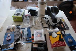 lot 524 image: Lot of (15) Bike Accessories (in original packaging) - spoke Tools, Locks, Adapters, Tire Gauges, Mirrors, Seat, Bottle, Bottle Holders, Phone Mounts and more