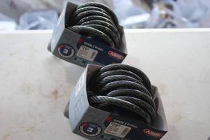 lot 559 image: Lot of (2) Abus Primo 5510K Keyed Coiled Cable Bike Locks 180cmx10mm (in original packaging)