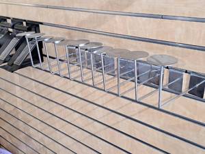 lot 1736 image: Lot of (11) Metal Slat Wall HatHelmet Hangers