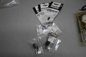 lot 844 image: Bike Accessories - Wheel Magnets (x3), Megnum Fender Clips (x4)