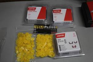 lot 848 image: Lot of (5) Tire Accessories - Zefal Rim Tape, Velo Plugs