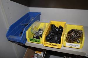 lot 1476 image: Lot of (4) Plastic Parts Organizer Bins with Nut Covers, Cassette, Rear Axle Parts, Misc. Parts