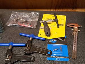lot 1761 image: Lot of (6) Park Tool Bike Tools - Chain Breakers, Chain Pins, Gauge, Plus Two Other Brand Chain Breaker