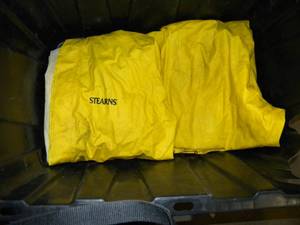lot 122 image: 3 Carpenter Aprons 3 Safety Vests 3 Tool Bags and a Stearns 2 Piece Rain Suit