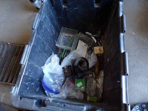 lot 109 image: Box Full of Large Drill Bits, Saw Blade, Nails, Screws, and Tool Belt