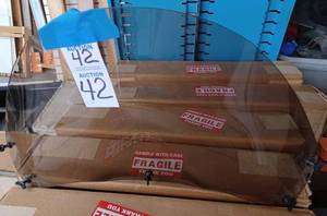 lot 42 image: Jet Technologies Boat Windshield and a Smaller Unmarked Boat Windshield